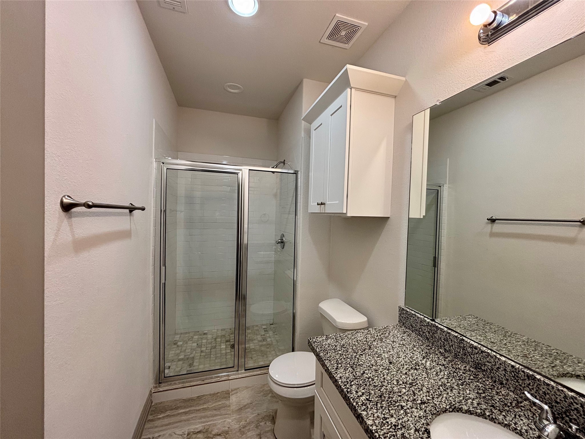 8918 Southview Street, Unit A Houston, TX 77051 - Photo 12 of 14 a spacious bathroom with a granite countertop sink toilet and shower