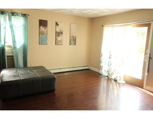 85 Family Drive Fall River, MA 02721 - Photo 11 of 31 a bedroom with a bed and wooden floor
