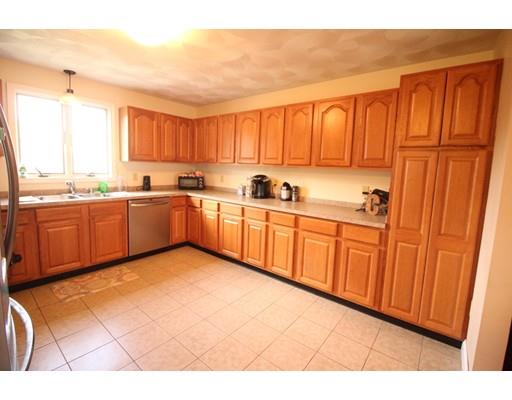 85 Family Drive Fall River, MA 02721 - Photo 24 of 31 a view of a kitchen with kitchen island granite countertop wooden cabinets