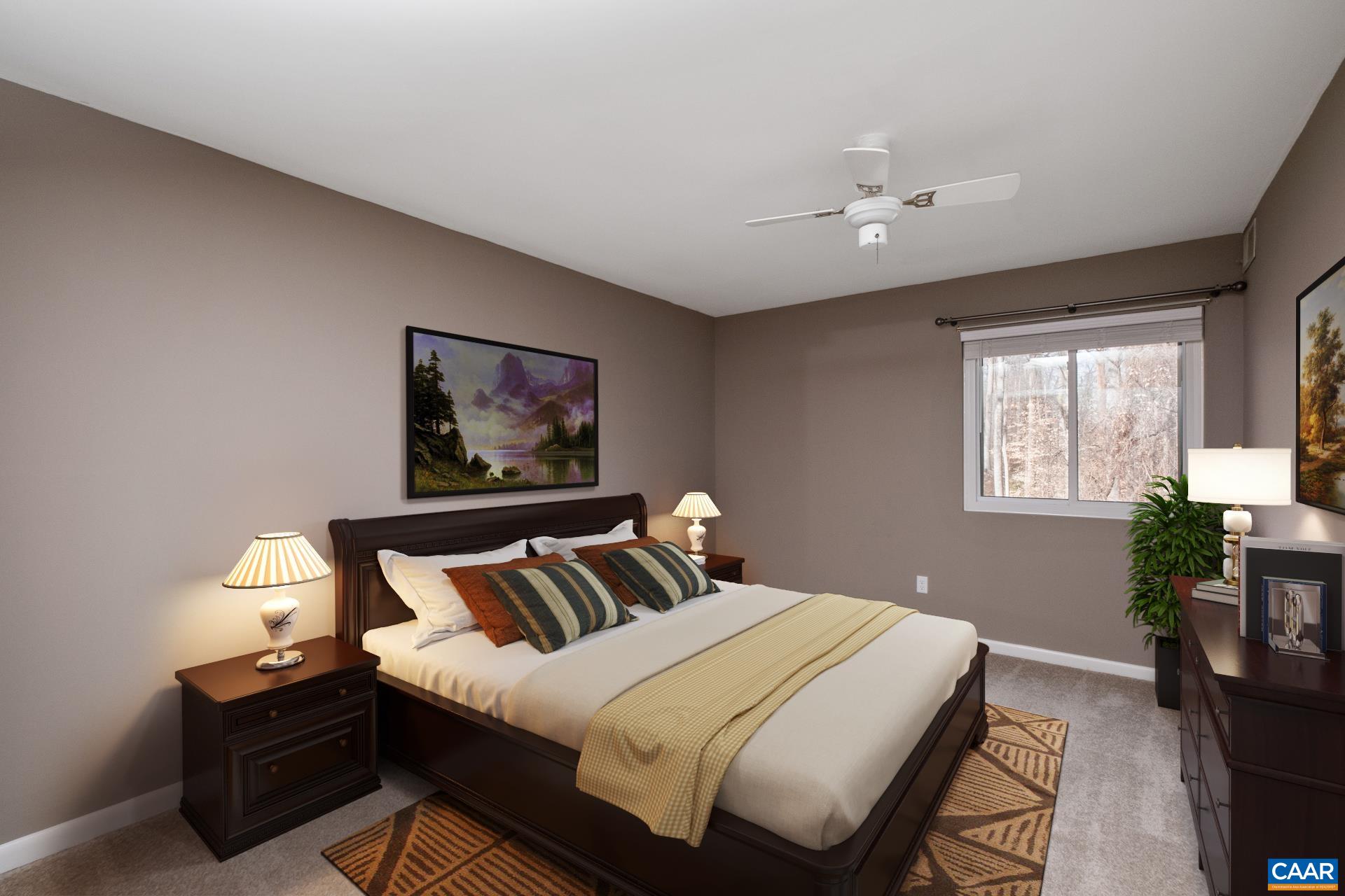 111 Turtle Creek Road, Unit 2 Charlottesville, VA 22901 - Photo 13 of 22 a bedroom with a bed and wooden floor