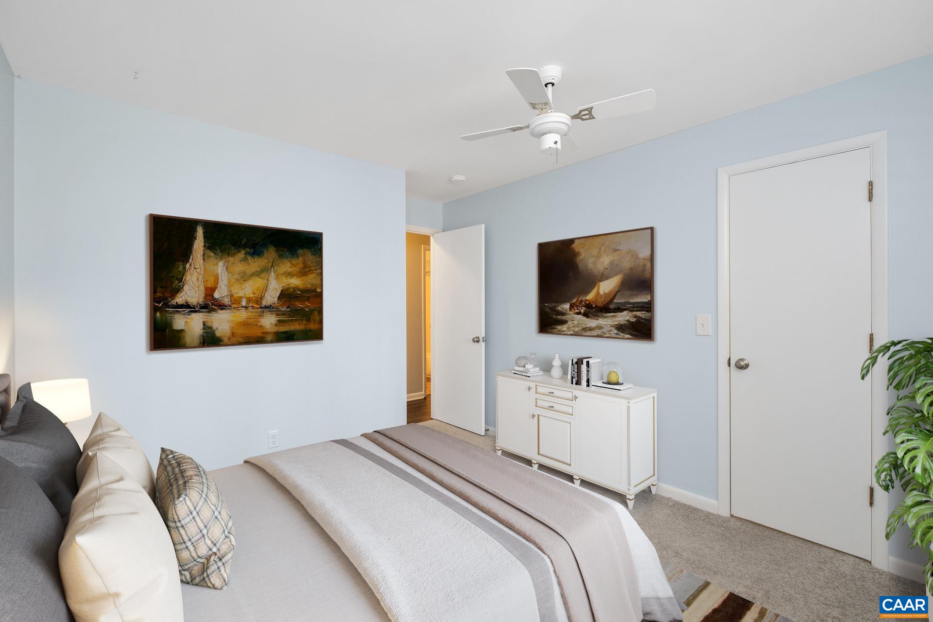 111 Turtle Creek Road, Unit 2 Charlottesville, VA 22901 - Photo 17 of 22 a bedroom with a bed and a flat screen tv