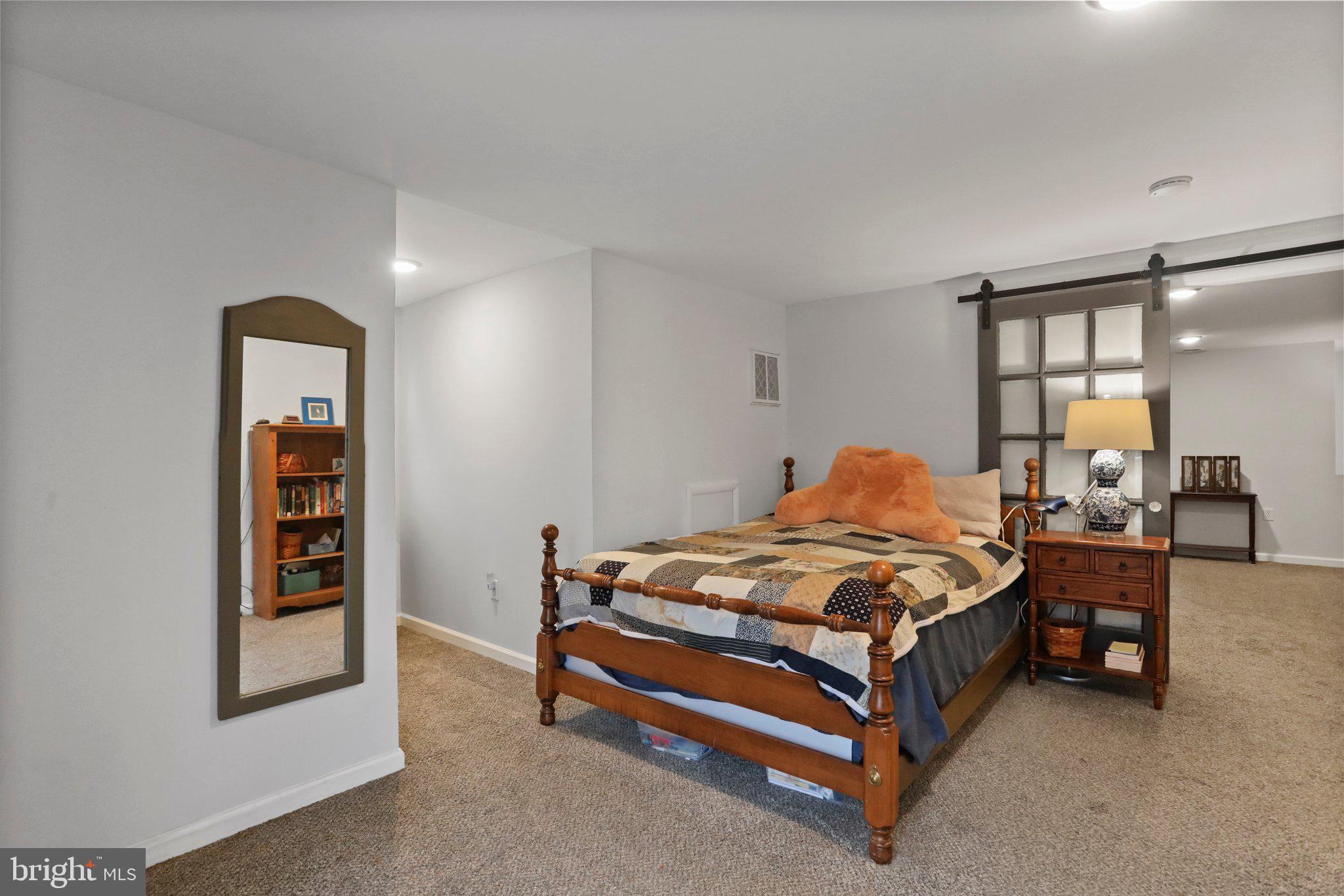 130 Traveller Road Falling Waters, WV 25419 - Photo 65 of 93 In-law suite upper level bedroom w/ barn door