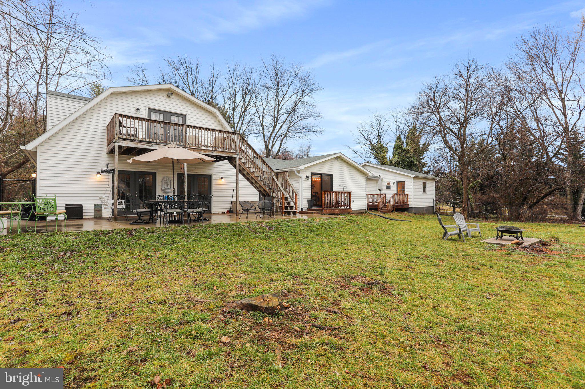 130 Traveller Road Falling Waters, WV 25419 - Photo 86 of 93 Rear view of home, in-law suite on the left