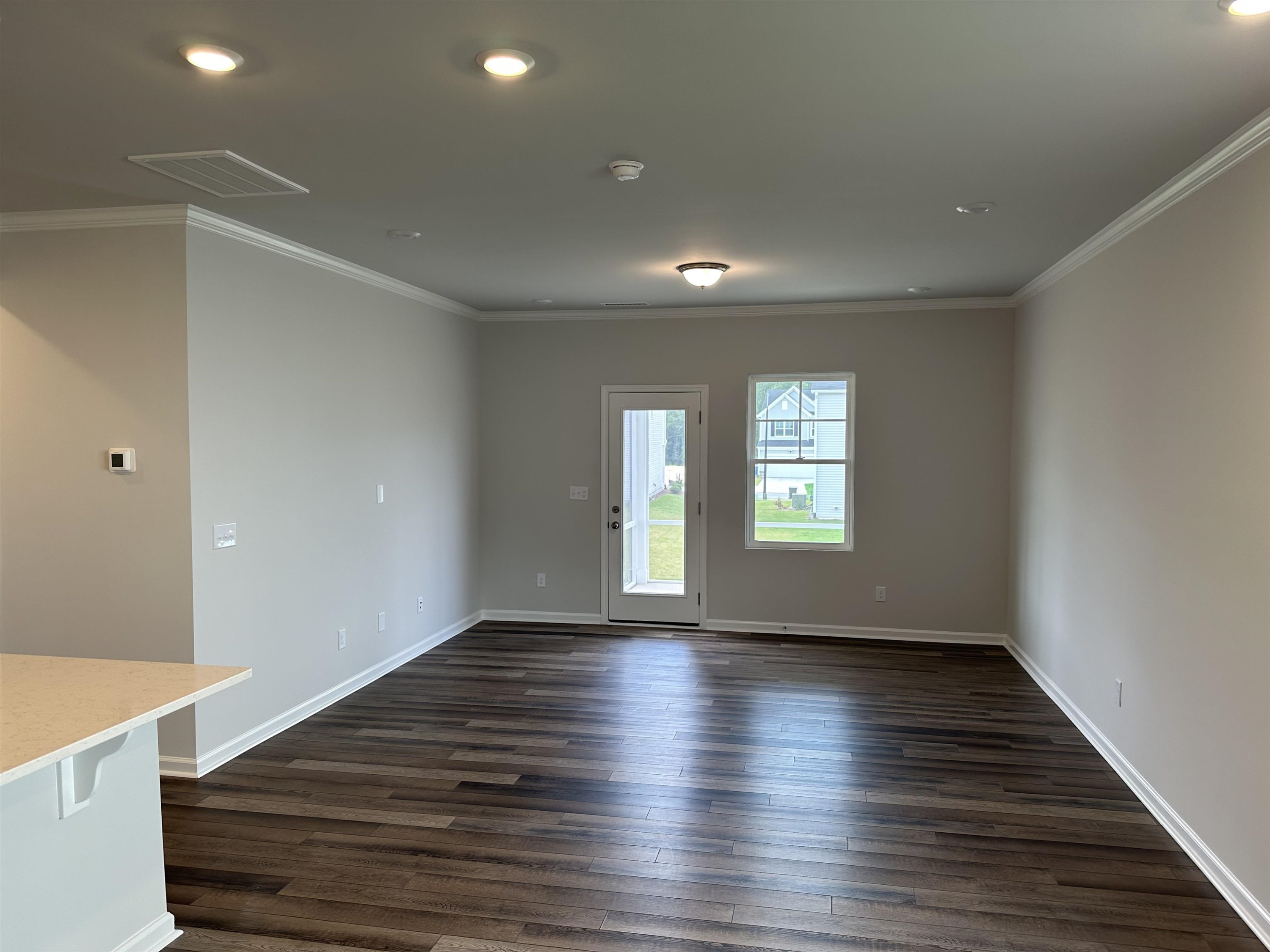 2509 Salt River Lane, Unit DAVIDSON C Raleigh, NC 27616 - Photo 4 of 6 an empty room with wooden floor and windows