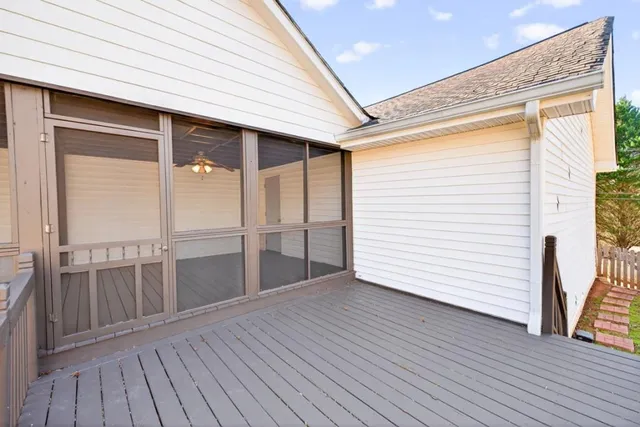 a view of a balcony with wooden floor