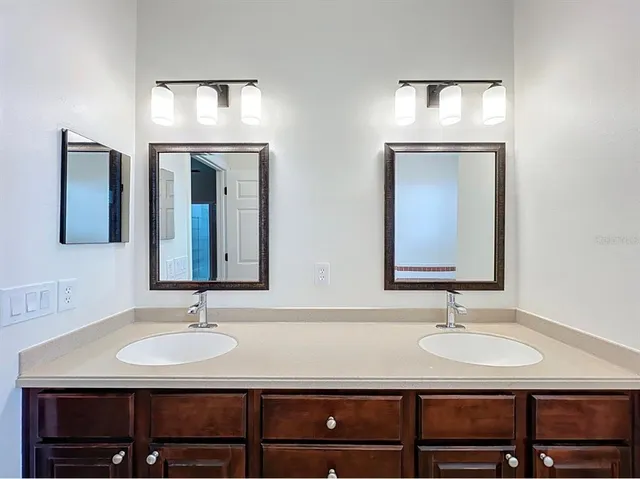 an empty room with a ceiling fan and window
