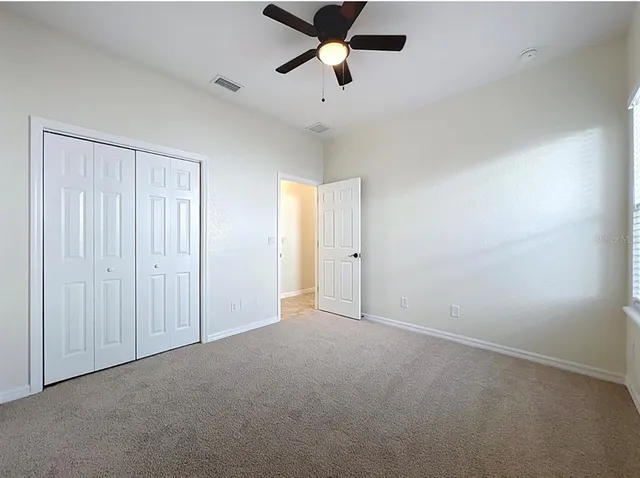a view of a hall with a floor to ceiling window