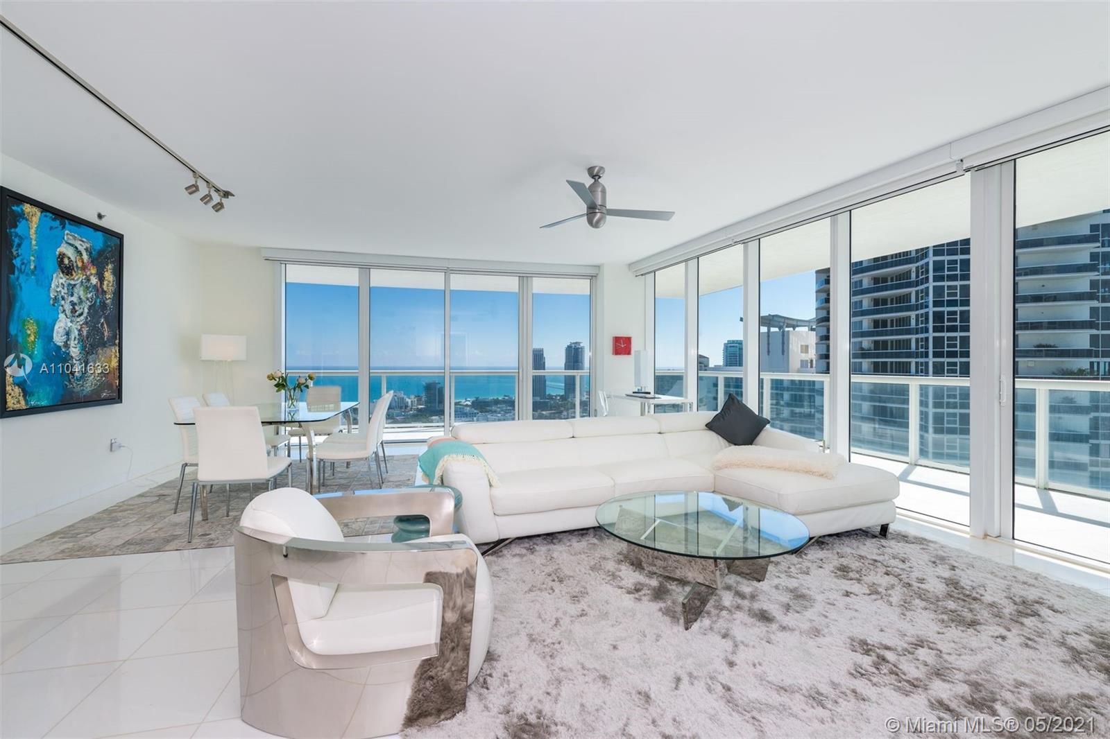 450 Alton Road, Unit 3207 Miami Beach, FL 33139 - Photo 16 of 31 a living room with furniture granite and a large window