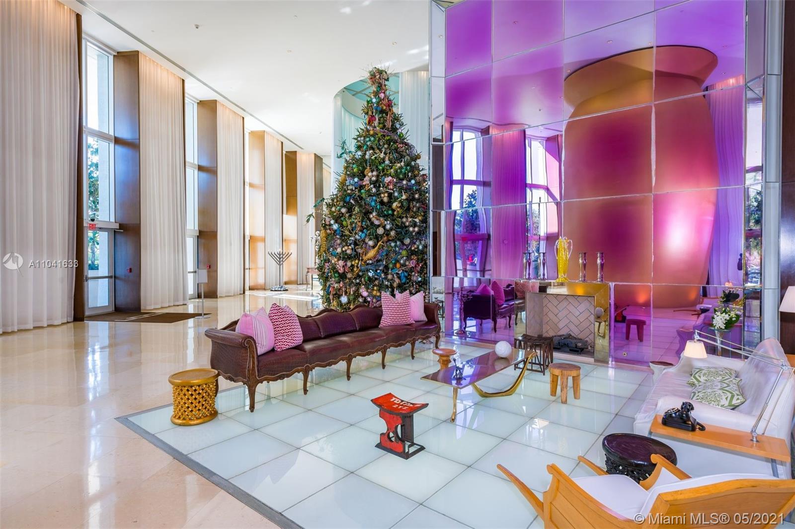 450 Alton Road, Unit 3207 Miami Beach, FL 33139 - Photo 25 of 31 a living room filled with furniture and a potted plant