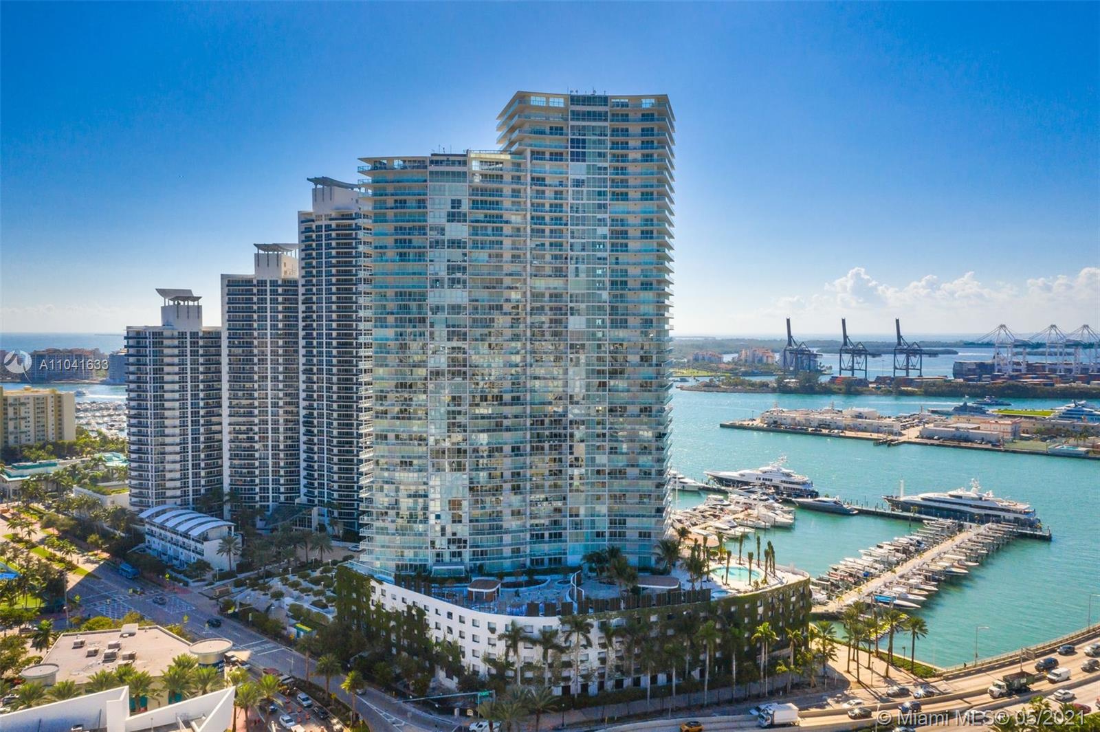 450 Alton Road, Unit 3207 Miami Beach, FL 33139 - Photo 27 of 31 a view of a city with tall buildings