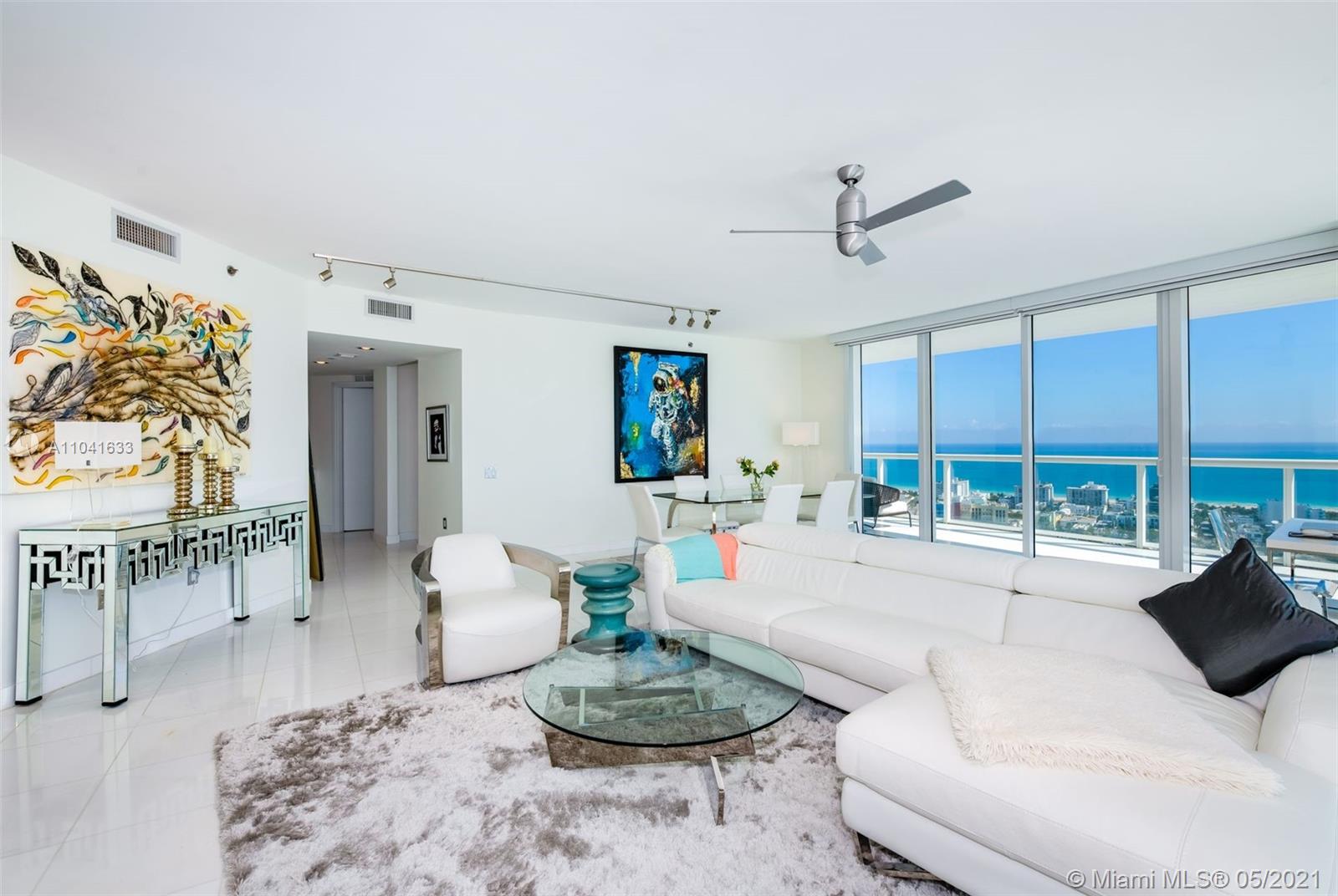450 Alton Road, Unit 3207 Miami Beach, FL 33139 - Photo 4 of 31 a living room with furniture and a table