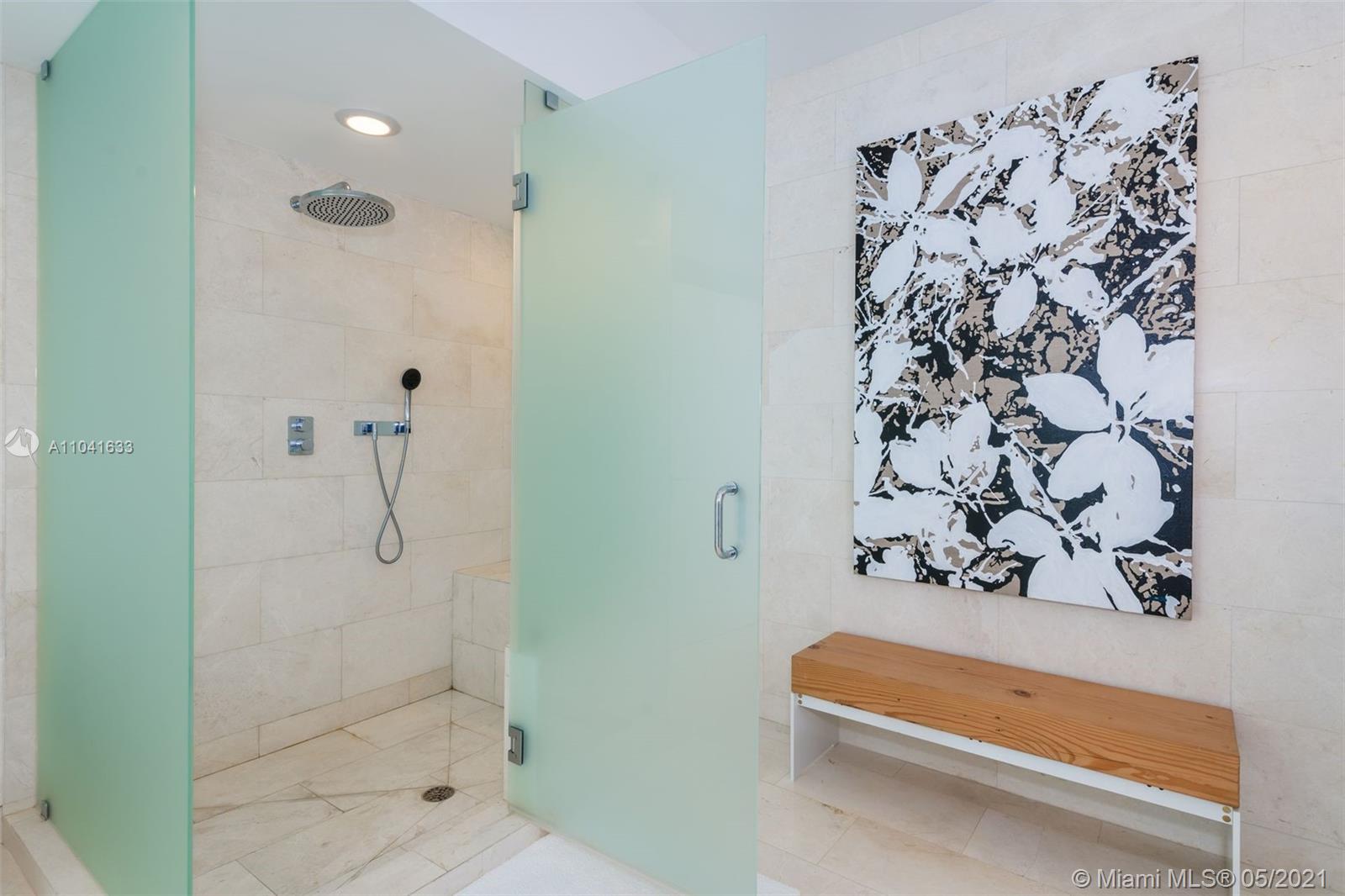 450 Alton Road, Unit 3207 Miami Beach, FL 33139 - Photo 9 of 31 a bathroom with a shower and a shower