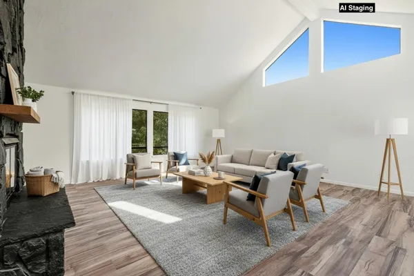 a view of a balcony with wooden fence and floor