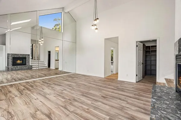 a view of a balcony with wooden fence