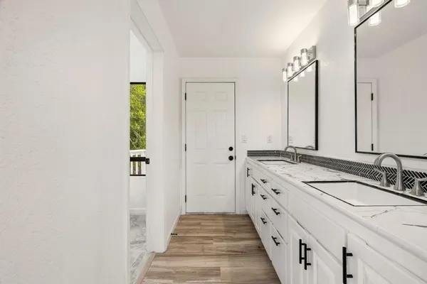 a view of a balcony with wooden floor