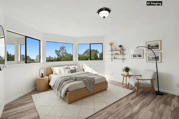 a view of a livingroom with furniture and wooden floor