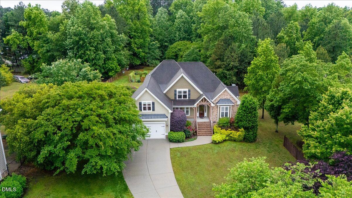 7400 Denlee Road Raleigh, NC 27603 - Photo 2 of 47 a house view with a garden space