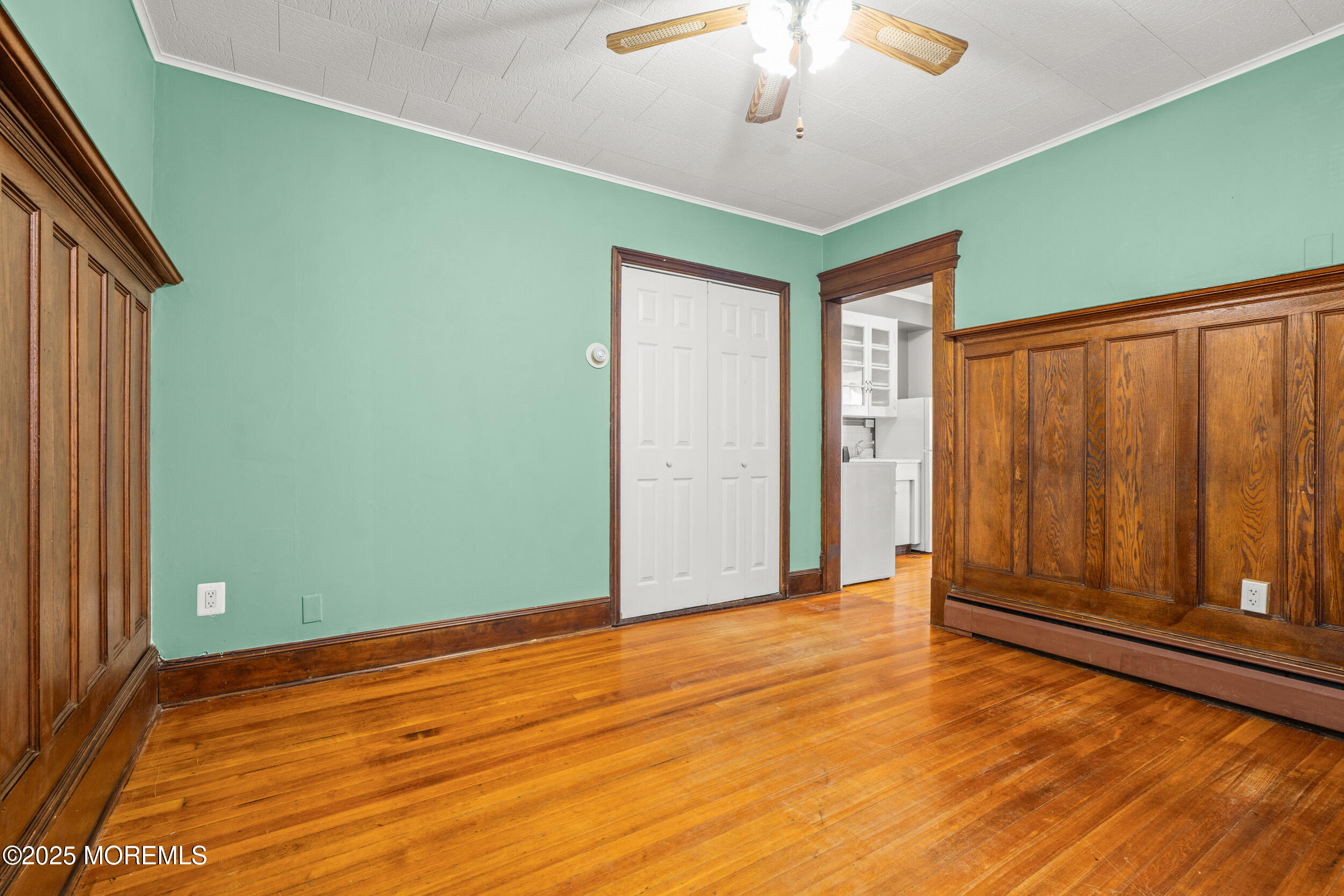 110 Mt Tabor Way Ocean Grove, NJ 07756 - Photo 13 of 71 a view of empty room with wooden floor and fan