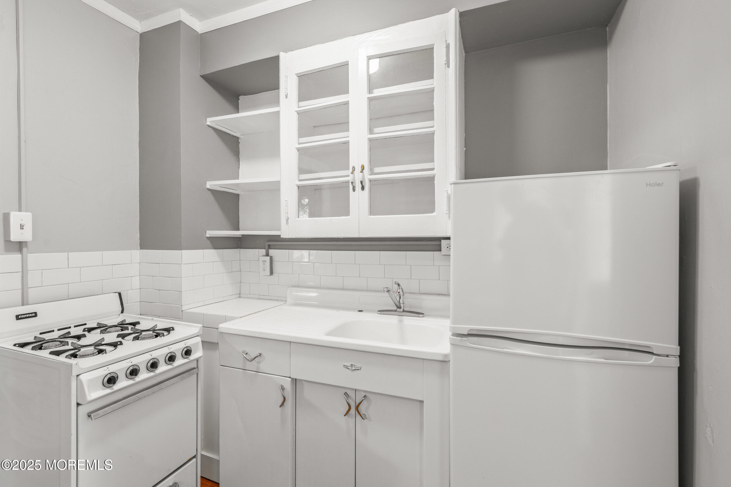 110 Mt Tabor Way Ocean Grove, NJ 07756 - Photo 15 of 71 a view of a kitchen with a sink and a refrigerator
