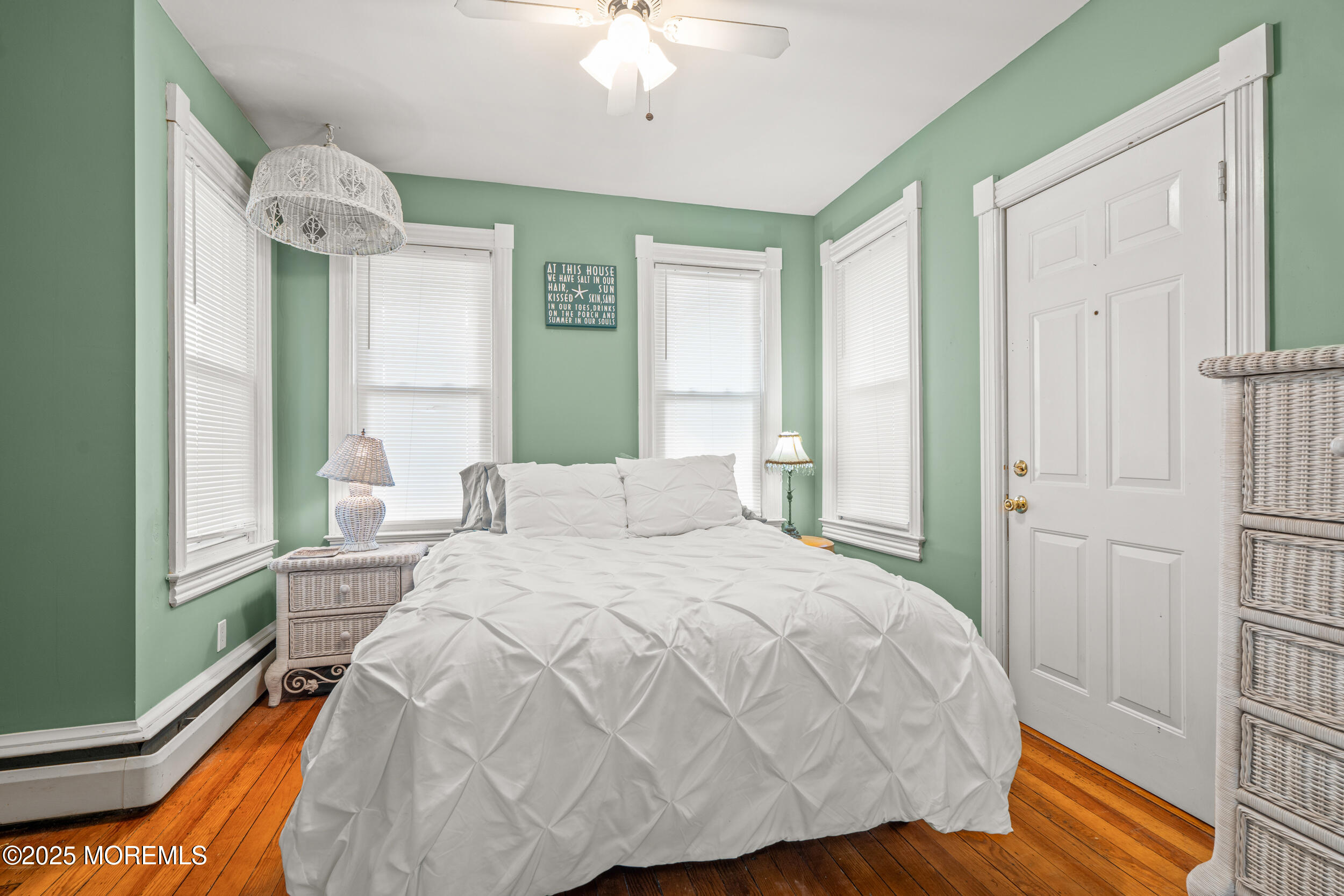 110 Mt Tabor Way Ocean Grove, NJ 07756 - Photo 30 of 71 a bedroom with a bed and a chandelier