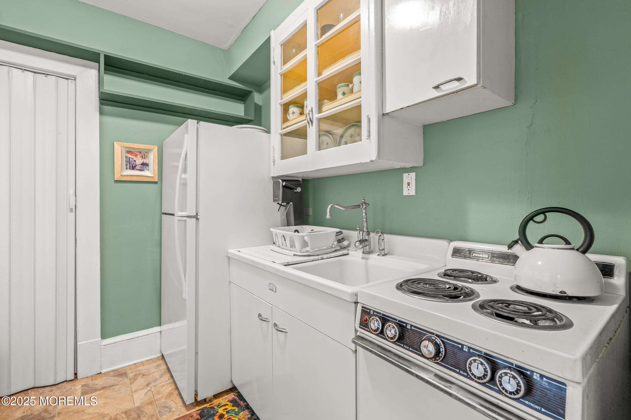 110 Mt Tabor Way Ocean Grove, NJ 07756 - Photo 32 of 71 a kitchen with a stove and a refrigerator