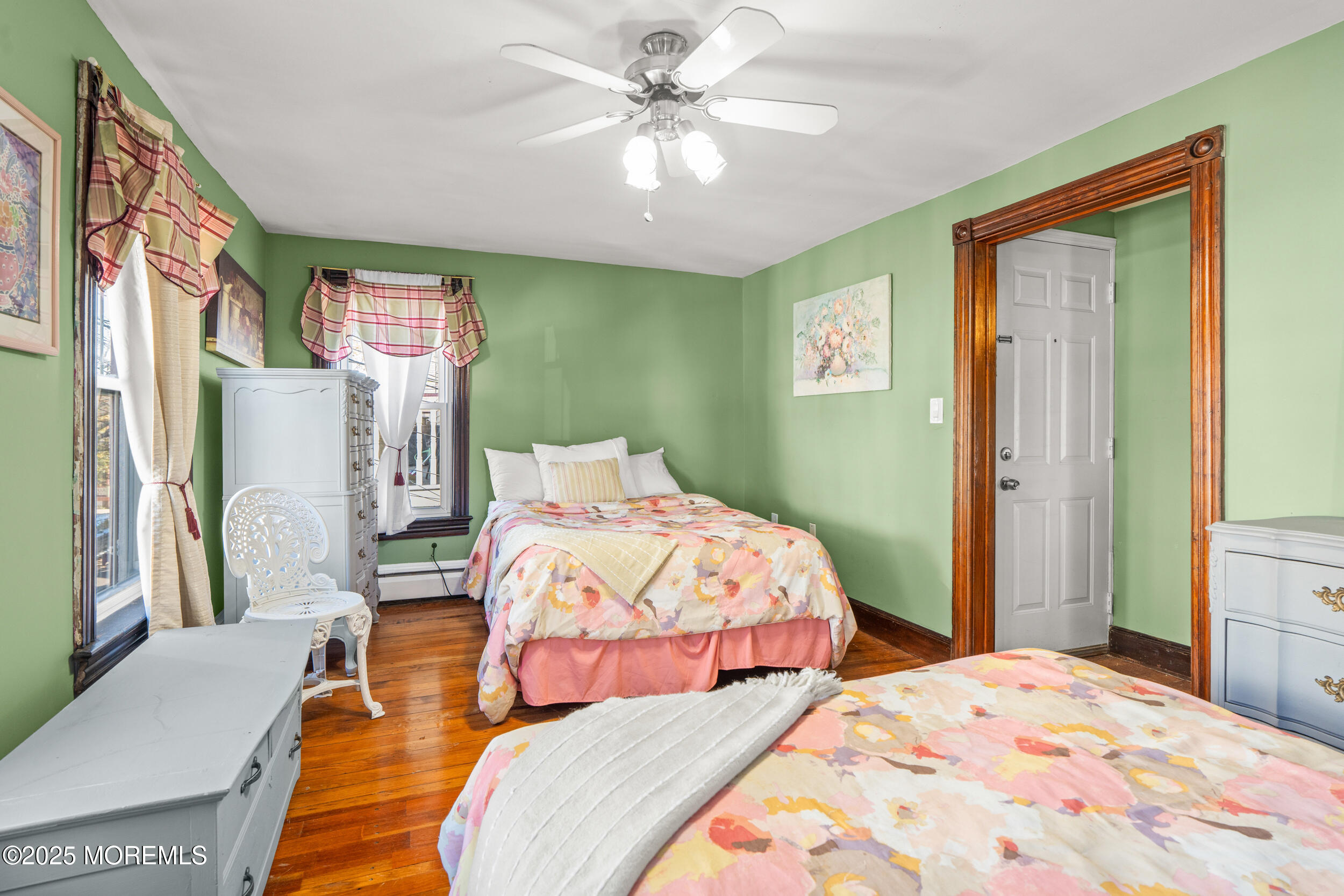 110 Mt Tabor Way Ocean Grove, NJ 07756 - Photo 53 of 71 a bedroom with a bed and a chandelier
