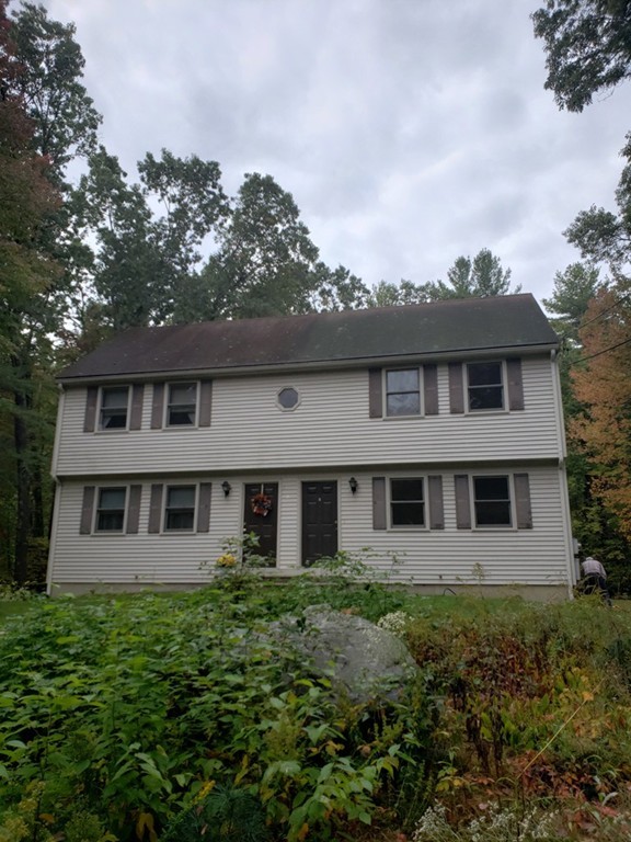 68 Lawton Road, Unit B Shirley, MA 01464 - Photo 1 of 14 front view of a house with a yard