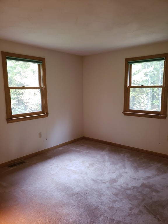 68 Lawton Road, Unit B Shirley, MA 01464 - Photo 11 of 14 an empty room with a window