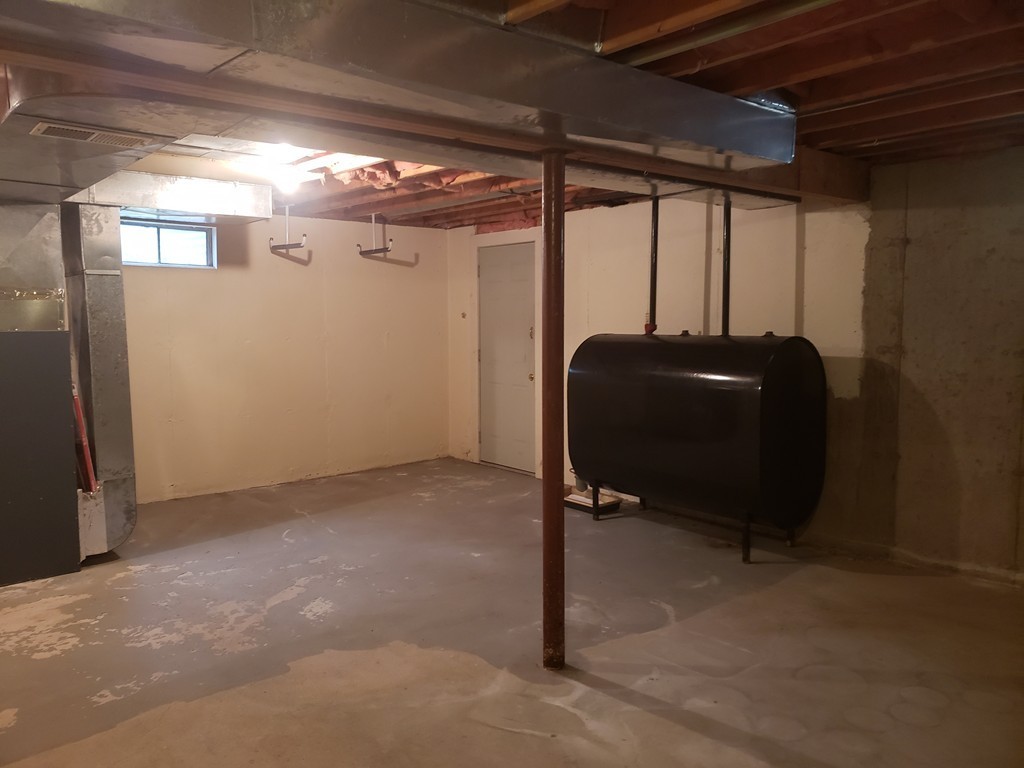 68 Lawton Road, Unit B Shirley, MA 01464 - Photo 12 of 14 a room with black glass door