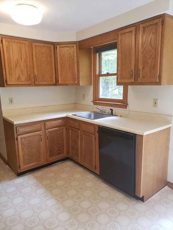 68 Lawton Road, Unit B Shirley, MA 01464 - Photo 4 of 14 a kitchen with a sink cabinets and window