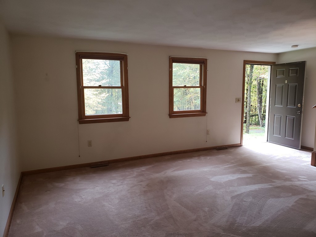 68 Lawton Road, Unit B Shirley, MA 01464 - Photo 7 of 14 an empty room with windows
