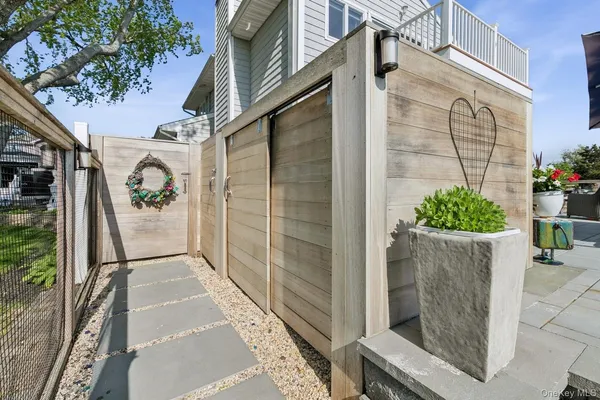 a view of balcony with wooden floor and stairs