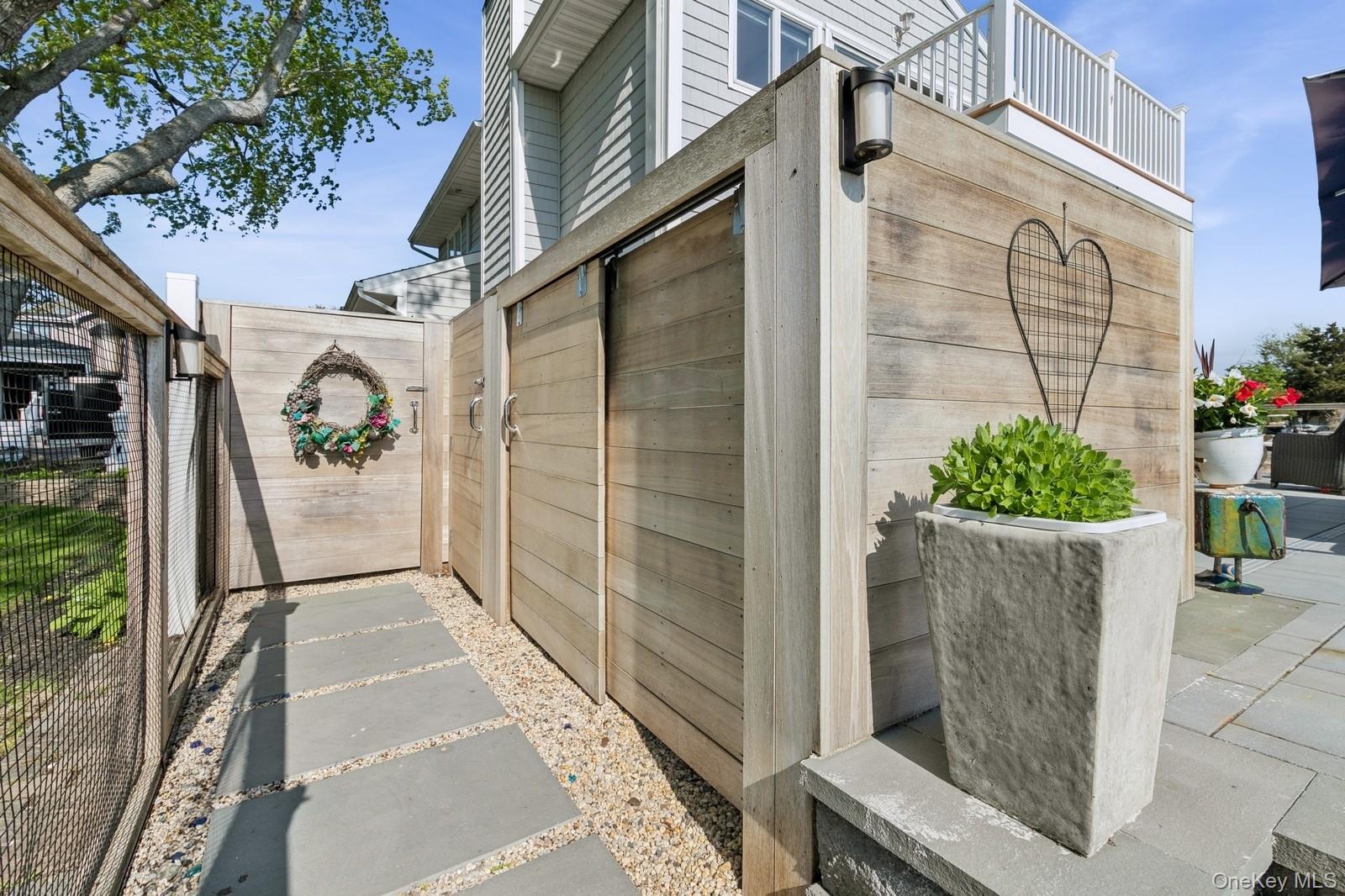 81 Beach Road Aquebogue, NY 11901 - Photo 11 of 34 a view of a street with potted plants