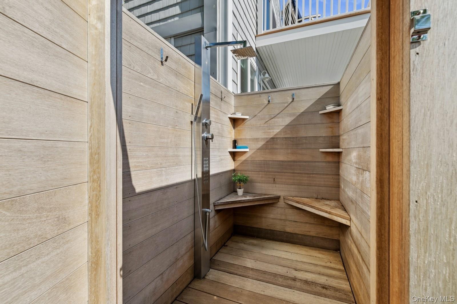 81 Beach Road Aquebogue, NY 11901 - Photo 12 of 34 a view of balcony with wooden floor and stairs