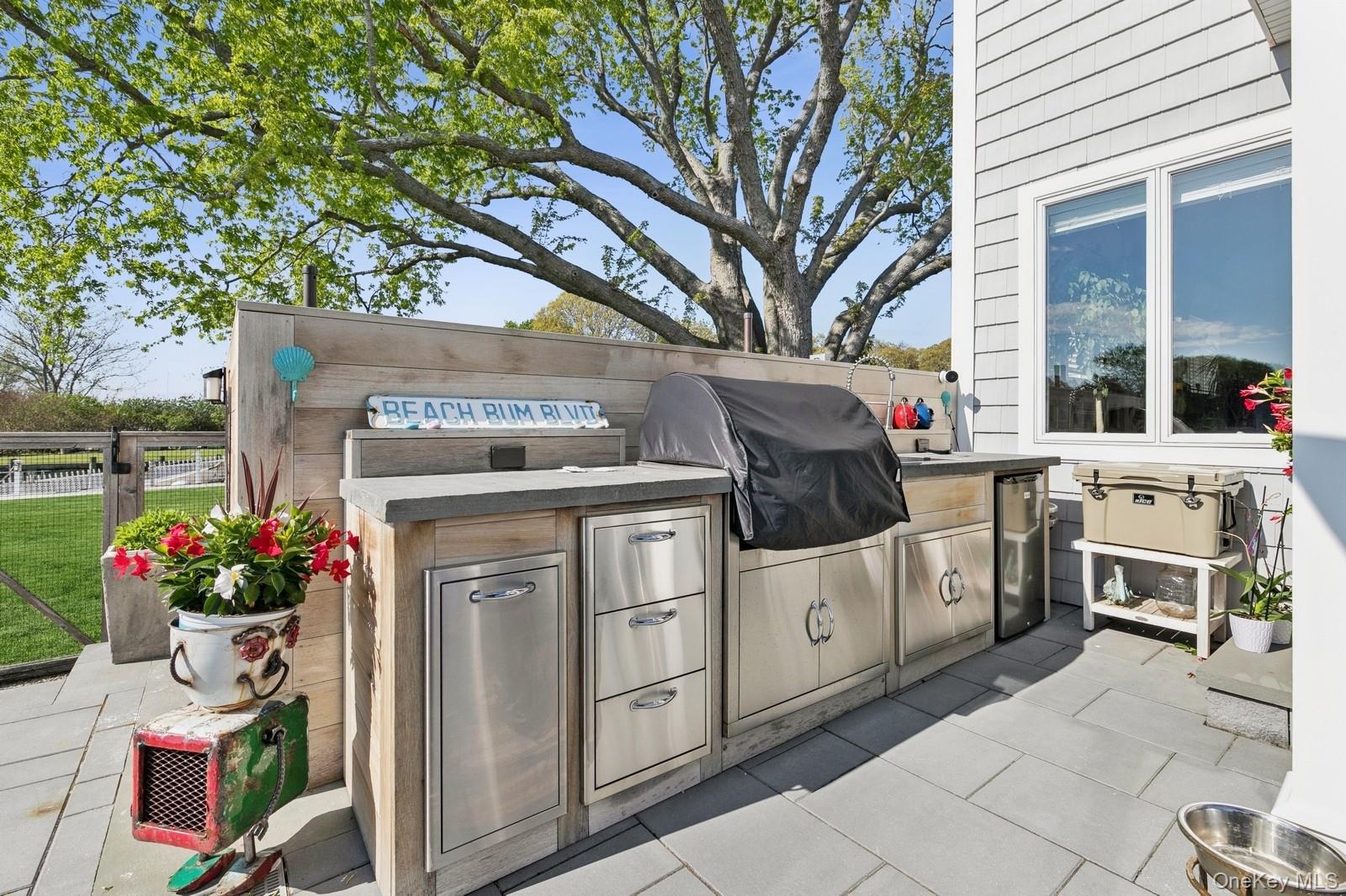 81 Beach Road Aquebogue, NY 11901 - Photo 14 of 34 a view of a kitchen with a stove and a microwave