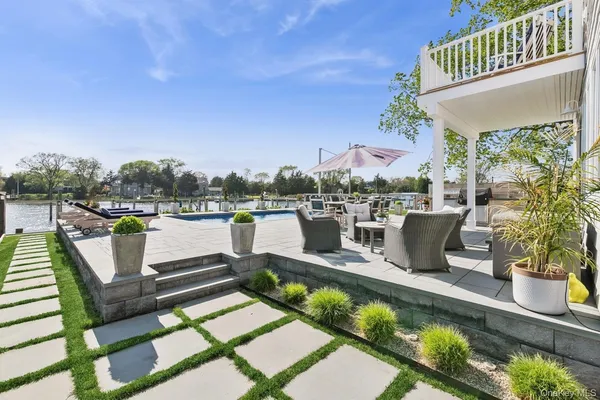 a view of a hallway with wooden floor and entryway