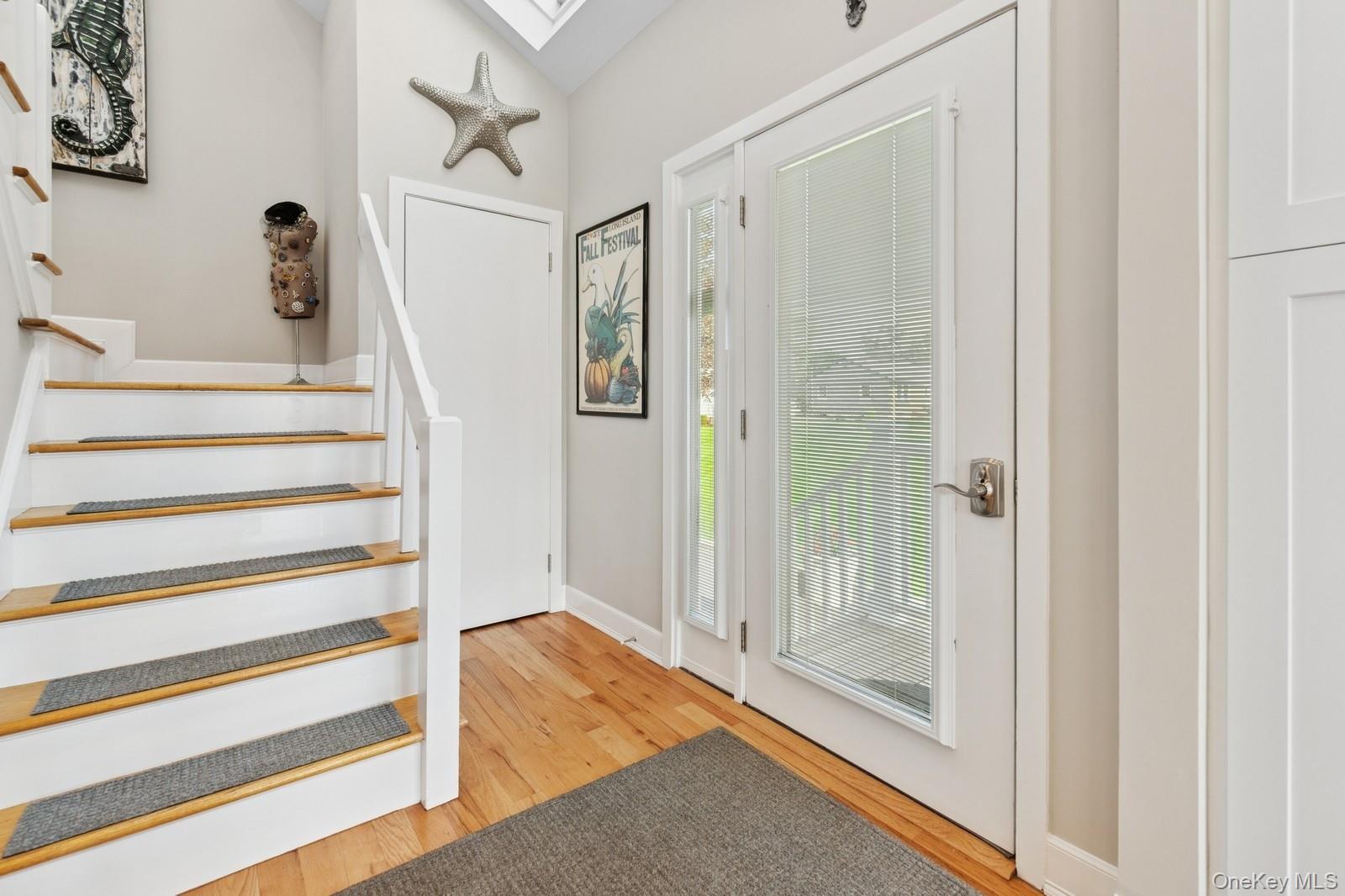 81 Beach Road Aquebogue, NY 11901 - Photo 16 of 34 a view of a hallway with wooden floor and entryway