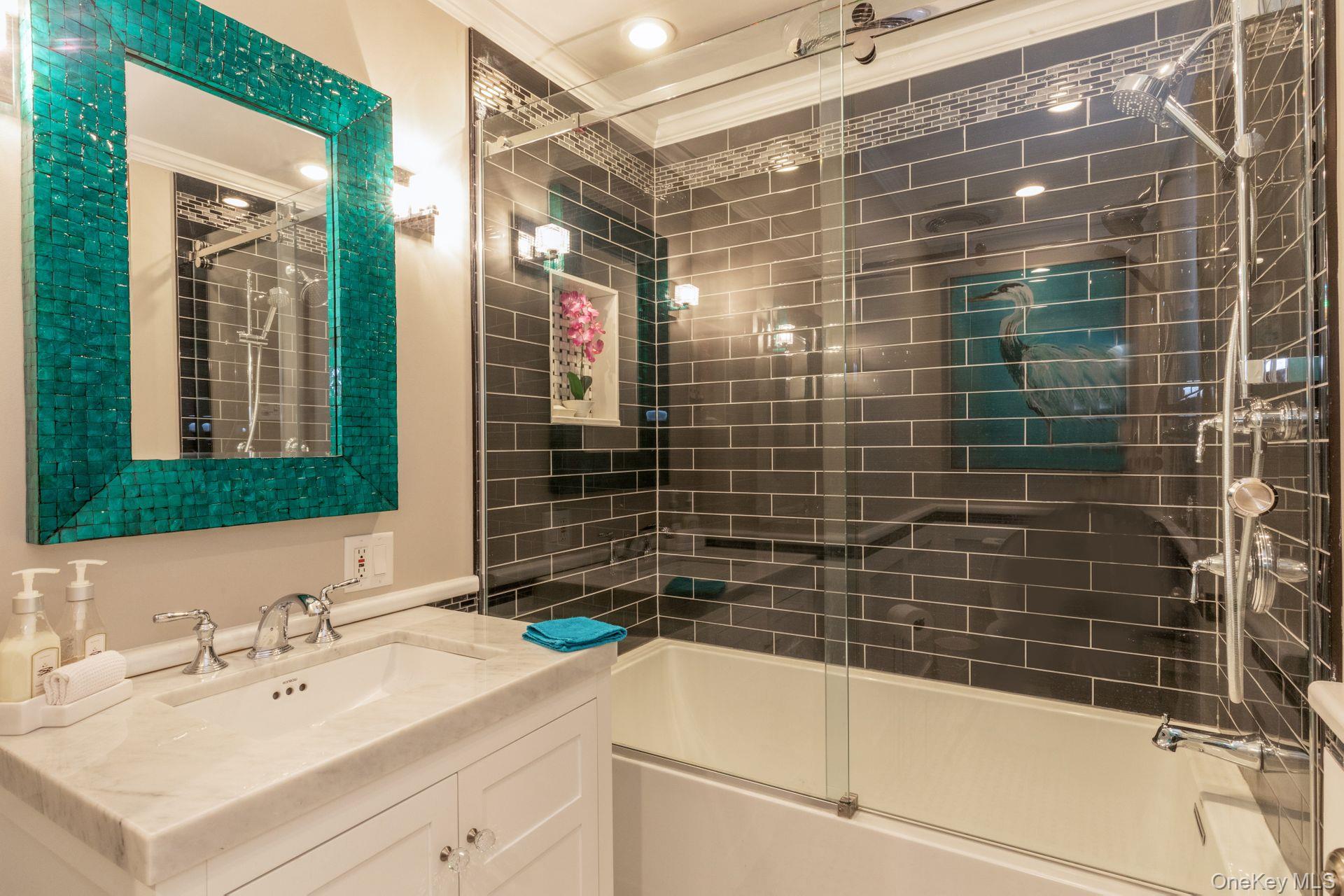 81 Beach Road Aquebogue, NY 11901 - Photo 23 of 34 a bathroom with a shower and a sink