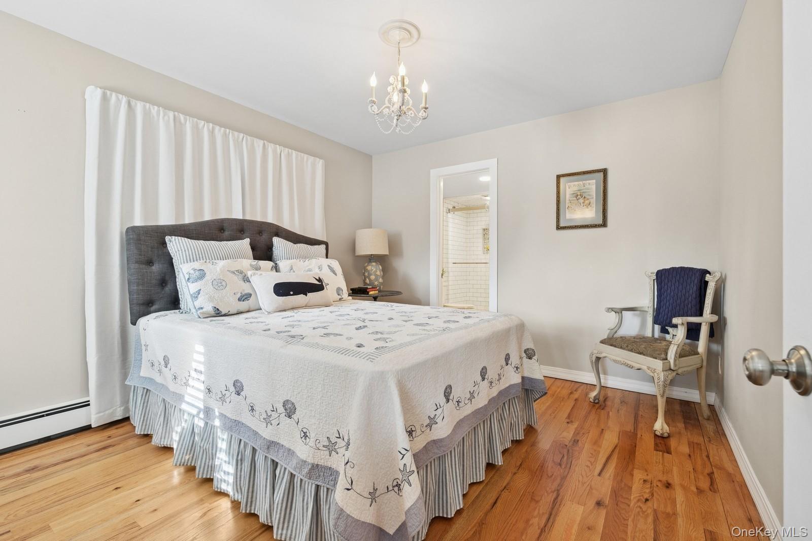 81 Beach Road Aquebogue, NY 11901 - Photo 24 of 34 a bedroom with bed and a window