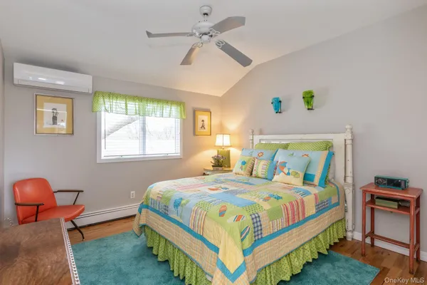 a bedroom with bed and a dresser