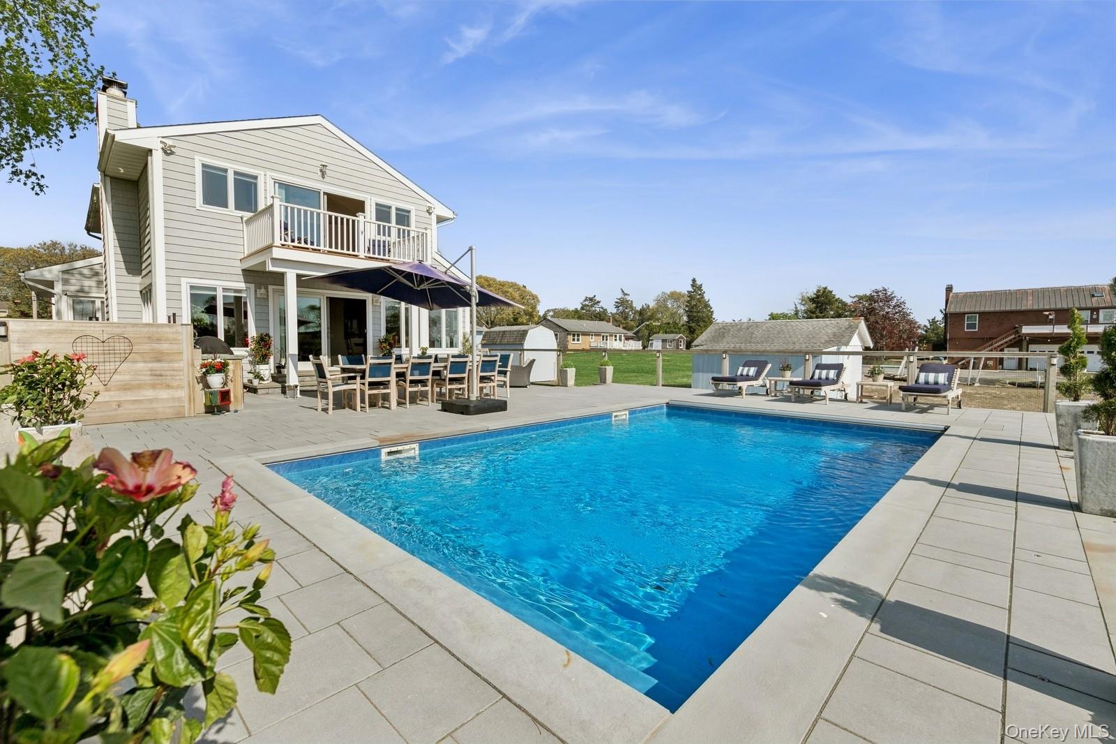 81 Beach Road Aquebogue, NY 11901 - Photo 8 of 34 a view of a house with outdoor space