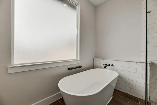 a bathroom with a sink and a window