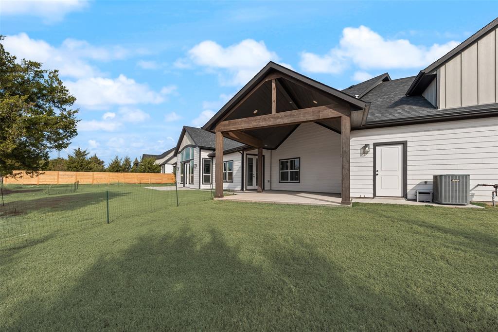 2335 Providence Way Nevada, TX 75173 - Photo 17 of 18 a front view of a house with garden