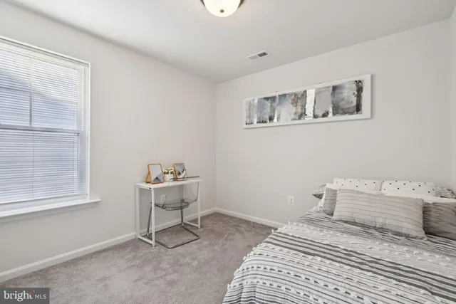 a bedroom with a bed and furniture