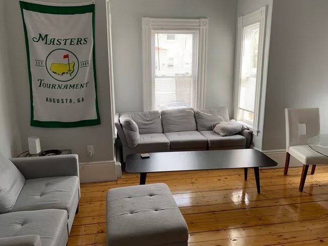 153 Chestnut Street, Unit 1 Waltham, MA 02453 - Photo 4 of 10 a living room with furniture and a window