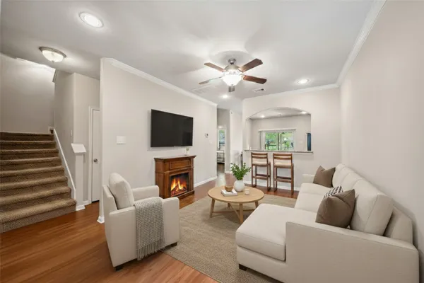 a living room with furniture fireplace and a flat screen tv