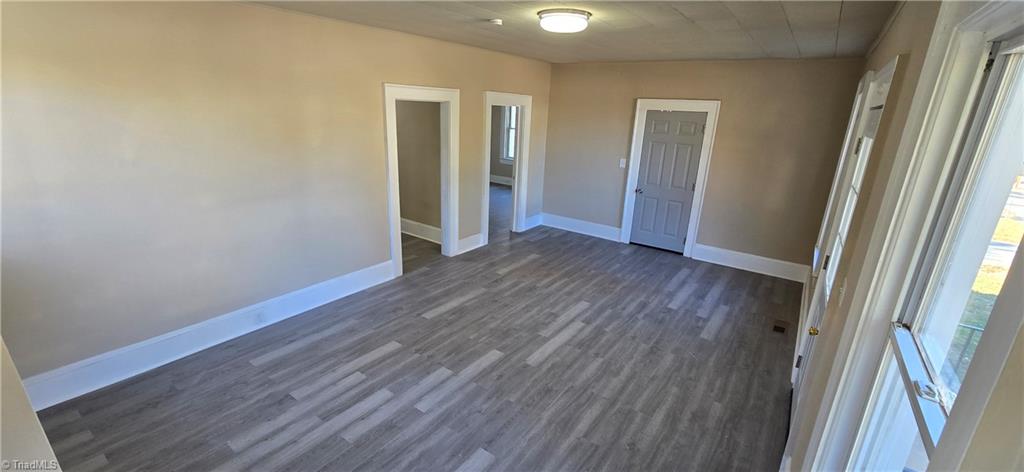 113 Edgeworth Street High Point, NC 27262 - Photo 6 of 24 Add'l living room view. Grey door leads to cozy covered side porch