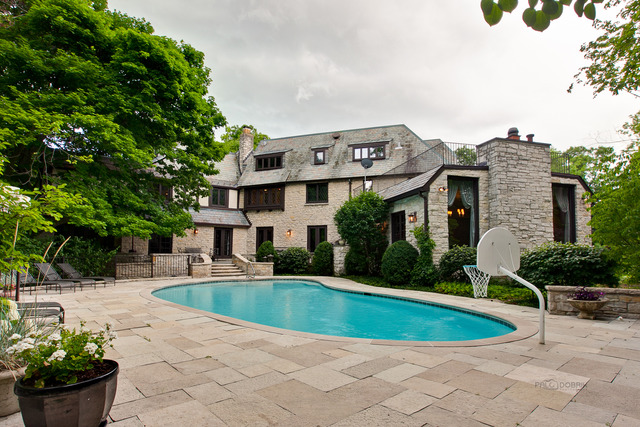 205 Franklin Road Glencoe, IL 60022 - Photo 22 of 25 a view of a house with a swimming pool and a chairs