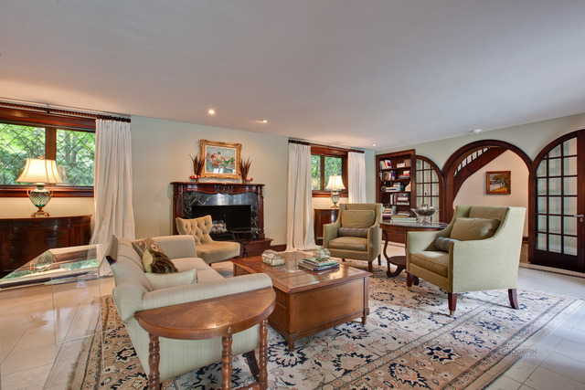 205 Franklin Road Glencoe, IL 60022 - Photo 6 of 25 a living room with furniture a fireplace and a table
