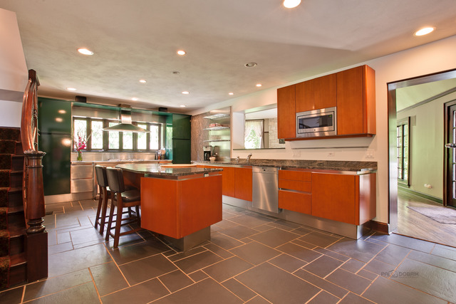 205 Franklin Road Glencoe, IL 60022 - Photo 10 of 25 a large kitchen with kitchen island a sink a counter and chairs